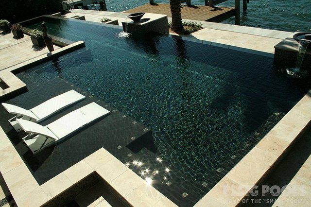 Pool with luxurious tanning ledge and lounge chairs